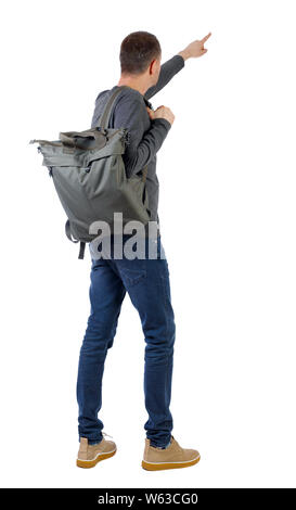 Back view of a man with a green backpack pointing forward. backside view of person. Isolated over white background. Stock Photo