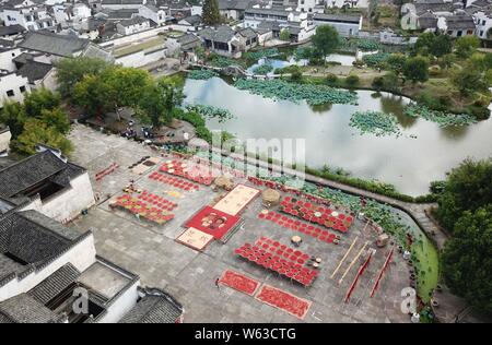 An aerial view of villagers airing and drying crops at Chengkan Ancient Village in Huangshan city, east China's Anhui Province, 12 September 2018. Stock Photo