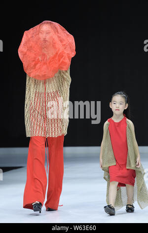 Models display new creations at the Dream x Classic of Mountains and Seas fashion show during the 2018 Beijing Fashion Week in Beijing, China, 21 Sept Stock Photo