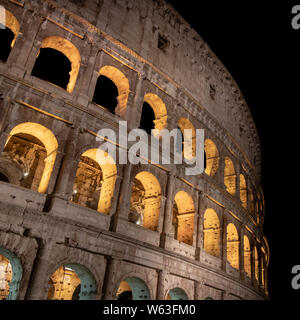 The famous Colosseum at night in Rome, Italy Stock Photo