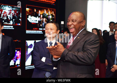 South African President Cyril Ramaphosa, right, walks with Jack Ma or Ma Yun, Chairman of Alibaba Group, during his visit at the Xixi campus and headq Stock Photo