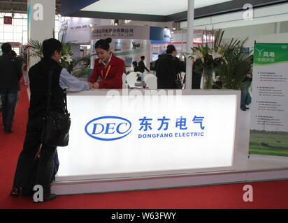 --FILE--People visit the stand of Dongfang Electric Corp during an exhibition in Beijing, China, 22 October 2014.   A Chinese consortium formed by two Stock Photo