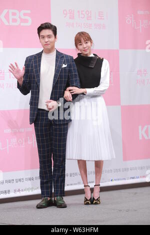 South Korean singer and actress Kim Yu-jin, better known by her stage name Uee or U-ie, right, and actor Lee Jang-woo attend a press conference to pro Stock Photo