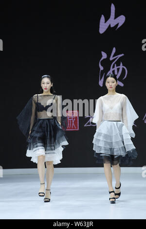 Models display new creations at the Dream x Classic of Mountains and Seas fashion show during the 2018 Beijing Fashion Week in Beijing, China, 21 Sept Stock Photo