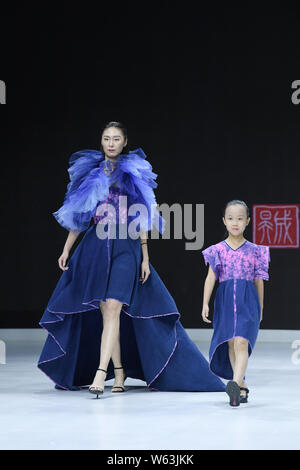 Models display new creations at the Dream x Classic of Mountains and Seas fashion show during the 2018 Beijing Fashion Week in Beijing, China, 21 Sept Stock Photo