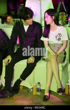 Thai actor and singer Mike D. Angelo of Thai pop duo Golf & Mike, left, and Chinese singer and actress Ju Jingyi attend a press conference for new TV Stock Photo