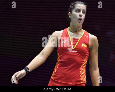Carolina Marin of Spain reacts as she competes against Gao Fangjie of China in their quarterfinal match of the women's singles during the VICTOR China Stock Photo