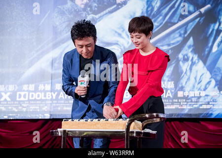 Chinese actress Sun Li, right, and her husband actor Deng Chao attend a premiere event for their new movie 'Shadow' directed by Chinese director Zhang Stock Photo