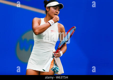 Wang Yafan of China celebrates after scoring against Amanda Anisimova of United States in their qualifying match of women's singles during the 2018 Do Stock Photo