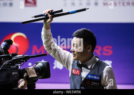Ding Junhui of China celebrates after defeating Mark Selby of England in their quarterfinal match during the 2018 Shanghai Masters snooker tournament Stock Photo