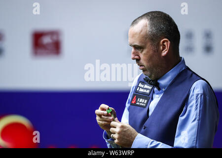 Mark Williams of Wales considers a shot to Anthony McGill of Scotland in their second round match during the 2018 Shanghai Masters snooker tournament Stock Photo