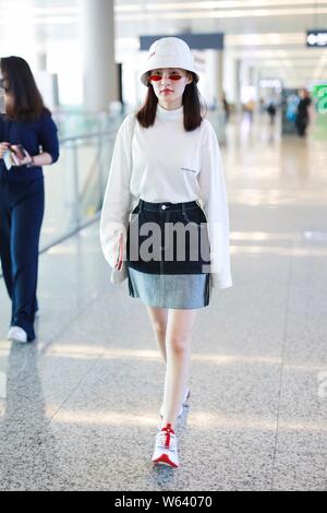 Chinese actress Li Qin arrives at the Shanghai Hongqiao International Airport before departure in Shanghai, China, 14 September 2018. Stock Photo