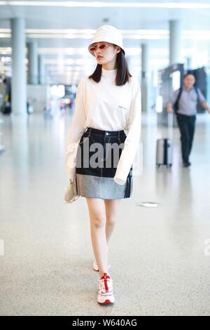 Chinese actress Li Qin arrives at the Shanghai Hongqiao International Airport before departure in Shanghai, China, 14 September 2018. Stock Photo