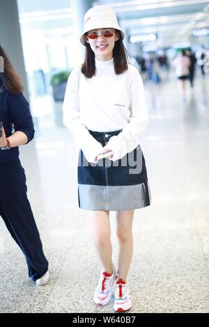 Chinese actress Li Qin arrives at the Shanghai Hongqiao International Airport before departure in Shanghai, China, 14 September 2018. Stock Photo