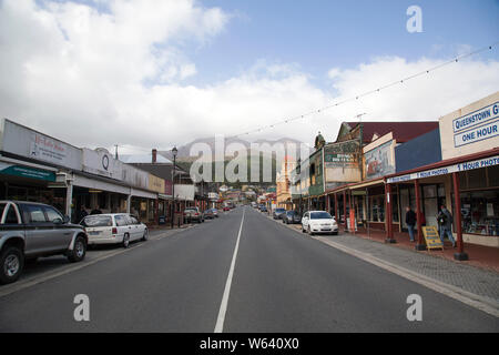 Queenstown, Tasmania: April 03, 2019: Orr Street is in the retail centre of Queenstown with hotels, shops and restaurants is overlooked by Mount Owen. Stock Photo
