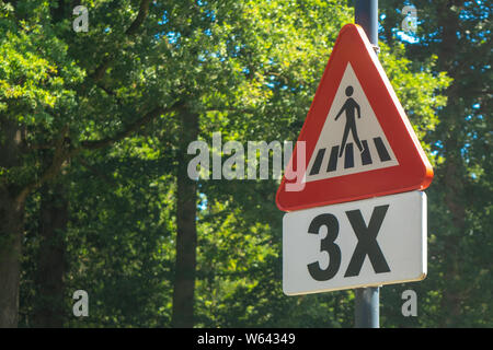 Dutch road sign: Watch out there is a pedestrian crossing Stock Photo