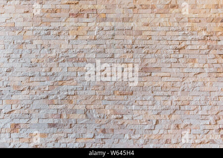 Background and texture stone cladding wall. Stock Photo