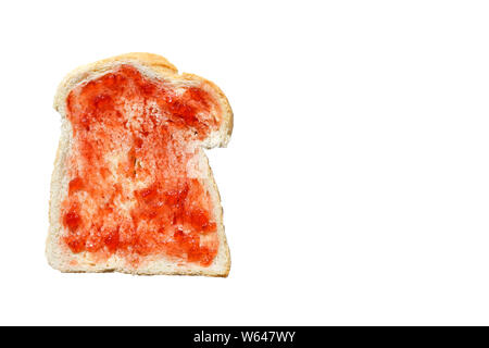 One slice of white bread spread with strawberry jam - directly above with copy space. Stock Photo
