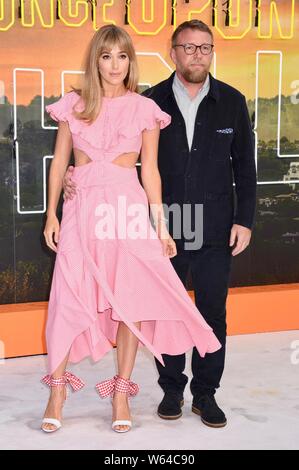 Jacqui Ainsley, Guy Ritchie. 'Once Upon A Time...In Hollywood.' UK Premiere, Odeon Luxe, Leicester Square, London. UK Stock Photo