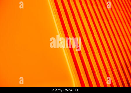 Orange background. plastic bag. Waste recycling concept. Environmental Protection. Polyethylene background texture.plastic containers stack . Concept Stock Photo