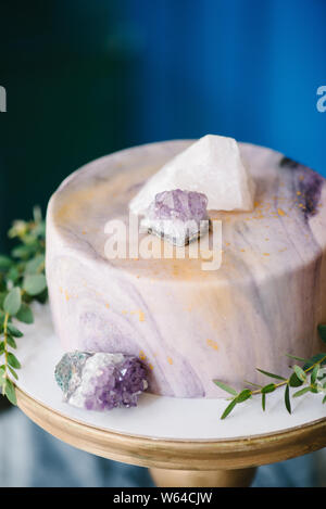 Elegant marble cake with stones, crystals. Wedding or birthday bakery Stock Photo