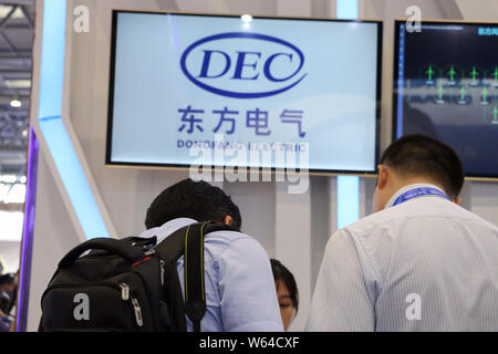 --FILE--People visit the stand of Dongfang Electric Corp during the first Smart China Expo (SCE) in Chongqing, China, 23 August 2018.    A Chinese con Stock Photo