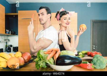 Couple making salad and cooking together Stock Photo