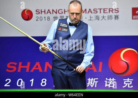Mark Williams of Wales considers a shot to Anthony McGill of Scotland in their second round match during the 2018 Shanghai Masters snooker tournament Stock Photo
