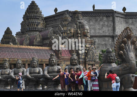 Tourists visit a replica of Cambodia's Angkor Wat temple complex at a tourist attraction in Nanning city, south China's Guangxi Zhuang Autonomous Regi Stock Photo