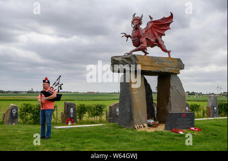 A lone Piper rehearses at the Welsh Memorial Park, Ypres prior to participating in the Last Post Ceremony at the Menin Gate, Ypres. Stock Photo