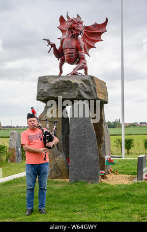 A lone Piper rehearses at the Welsh Memorial Park, Ypres prior to participating in the Last Post Ceremony at the Menin Gate, Ypres. Stock Photo