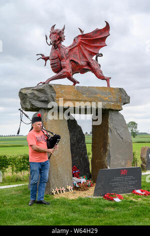 A lone Piper rehearses at the Welsh Memorial Park, Ypres prior to participating in the Last Post Ceremony at the Menin Gate, Ypres. Stock Photo