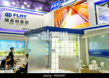 --FILE--People visit the stand of Flat Glass Group Co., Ltd. during the SNEC 2018 PV Power Expo in Shanghai, China, 30 May 2018.   Shares of photovolt Stock Photo