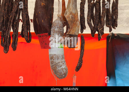 Amsterdam, Netherlands - February 25, 2017: Beef sausages hang in a row. Goods of Noordermarkt outdoor market in Amsterdam Stock Photo