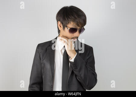 Portrait Businessman in Black Suit and Black Eyeglasses or Eyewear. Portrait businessman wear white shirt and suit in smart pose style Stock Photo