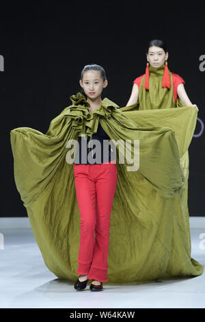 Models display new creations at the Dream x Classic of Mountains and Seas fashion show during the 2018 Beijing Fashion Week in Beijing, China, 21 Sept Stock Photo