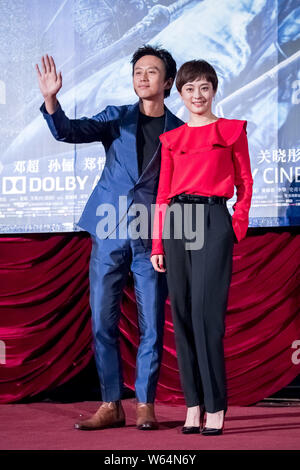 Chinese actress Sun Li, right, and her husband actor Deng Chao attend a premiere event for their new movie 'Shadow' directed by Chinese director Zhang Stock Photo