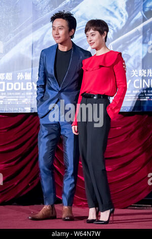 Chinese actress Sun Li, right, and her husband actor Deng Chao attend a premiere event for their new movie 'Shadow' directed by Chinese director Zhang Stock Photo