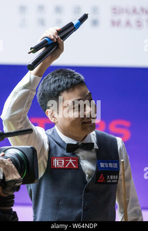 Ding Junhui of China celebrates after defeating Mark Selby of England in their quarterfinal match during the 2018 Shanghai Masters snooker tournament Stock Photo
