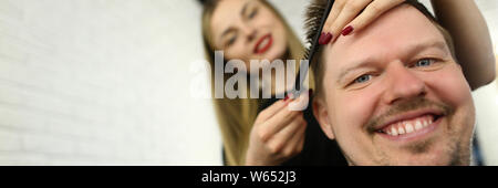 Hairdresser Combing Male Hair in Beauty Salon Stock Photo
