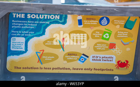 Lyme Regis, Dorset, UK. 31st July, 2019. UK Weather: A giant litter sculpture of takeaway packaging hat has been erected on the picturesque beach at the seaside resort of Lyme Regis. Consisting of an 8 foot high plastic drinks bottle, cutlery measuring 6 foot tall and a chip/burger box measuring 4x4 foot the sculptures promote the efforts of Litter Free Coast and partners in promoting environmentally responsible choices. It is hoped that the temporary installation by architectural designer Jack Raisey will encourage visitors take their litter home. Credit: Celia McMahon/17�Թ����� Live News Credit: Stock Photo