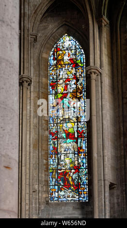 St. Joan of Arc stained glass window, life scenes, colorful, religious art, Notre Dame Cathedral; old Catholic church, Europe, Normandy; Rouen; France Stock Photo