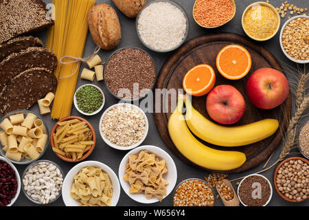 Gluten free grains, bread, pasta and fruits on wood Stock Photo