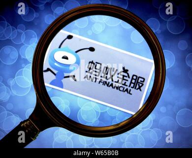 --FILE--A Chinese netizen looks at a logo of Alipay, the online payment service of Chinese e-commerce giant Alibaba's Ant Financial, in Huaibei city, Stock Photo