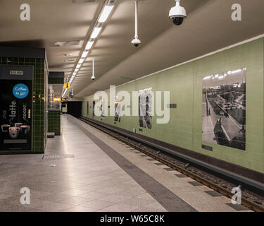Rehberge Strasse U-bahn Underground railway station interior with platform, green tiled walls & historic old monochrome photographs in Wedding-Berlin Stock Photo