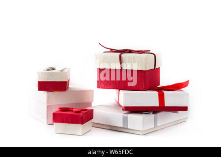 Some gift boxes isolated on white background. Christmas or birthday celebration concept. Stock Photo