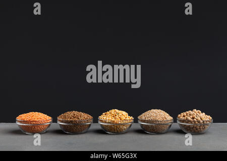 Set of different grains full of carbohydrates on black background Stock Photo