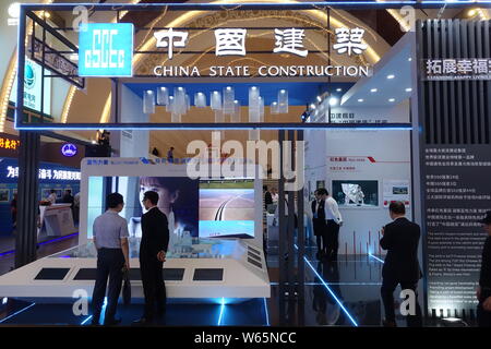 --FILE--People visit the stand of CSCEC (China State Construction Engineering Corporation) during an exhibition in Shanghai, China, 14 June 2018.    C Stock Photo