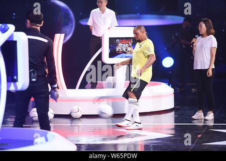 Retired Brazilian football player Roberto Carlos da Silva Rocha, more commonly known simply as Roberto Carlos, performs during a variety show in Beiji Stock Photo