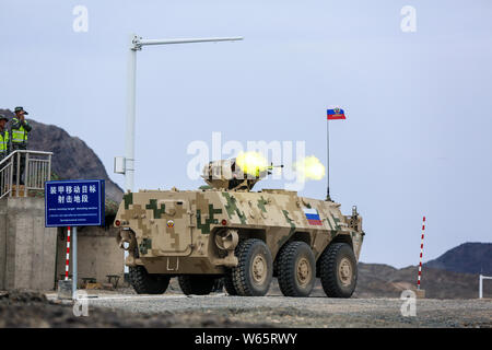 A Russian infantry fighting vehicle competes in a contest during the International Army Games 2018 in Korla city, northwest China's Xinjiang Uygur Aut Stock Photo